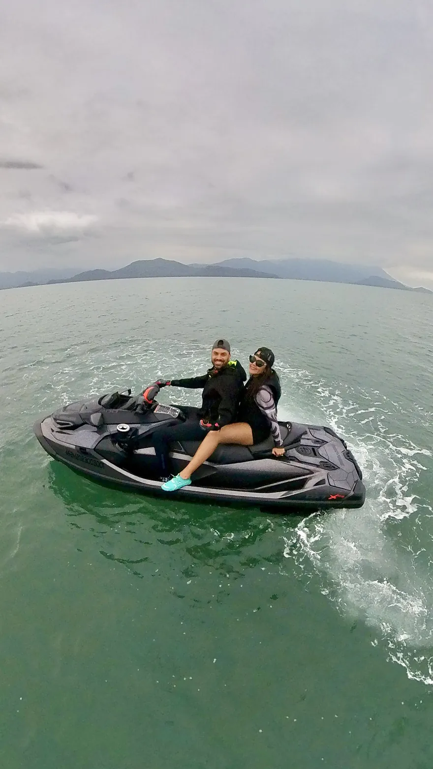 Friends riding a jet ski, ready to become a song